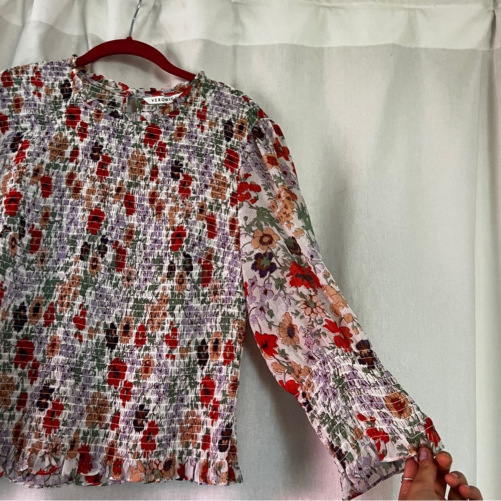 Veronica Beard Kali smocked blouse. Long sleeve with smocked bodice and cuffs.